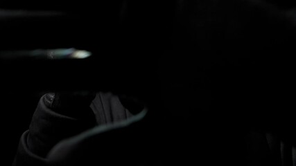 A intruder lurks about in a dark environment, inciting feelings of unease and tension