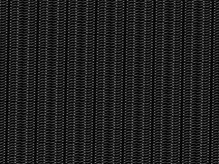 Black metal texture steel background. Perforated metal sheet. Texture of black carbon fiber.
