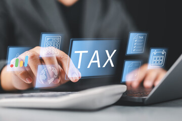 Tax and Vat concept. Government, state taxes concept. Businesman using laptop to complete Individual income tax return form online for tax payment. Data analysis, financial research.