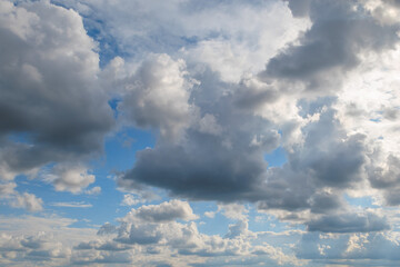Dramatic sky with fluffy and dark clouds