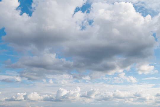 Dramatic sky with fluffy and dark clouds