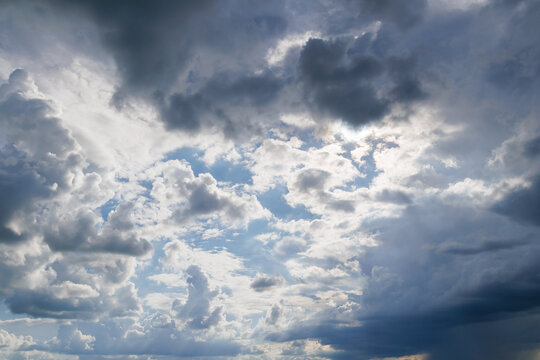 Dramatic sky with fluffy and dark clouds