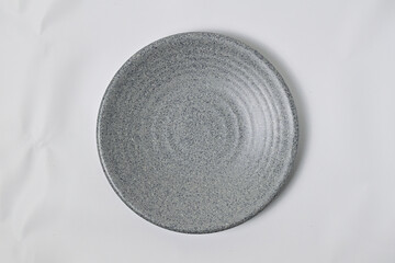 Top view of empty grey or gray plate isolated on white background