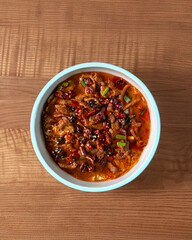 Chinese beef in pepper sauce with whole peppers. Beef cooked in Asian style