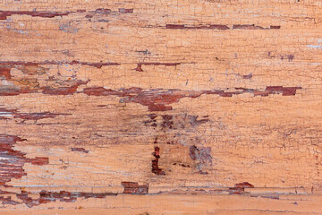 Close-up of weathered cracked peeling paint on wood