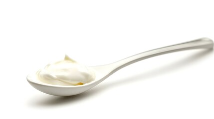 Spoon of fresh greek yogurt on white background