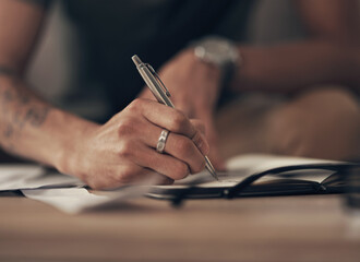 Finance, hands of man and writing notes with invoice, home budget and income tax report. Financial plan, asset management and person with notebook, paperwork and insurance application bills