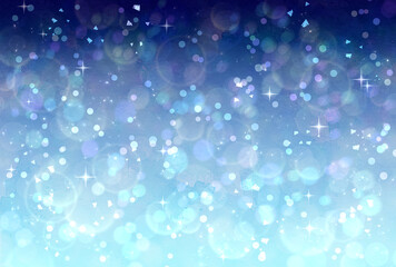 青と水色のグラデーションのキラキラ背景　イルミネーション　玉ボケ　光