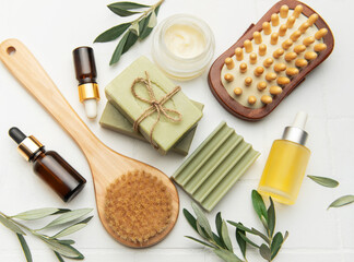 Natural olive oil soap, cream, essential oil and brushes creating relaxing spa kit