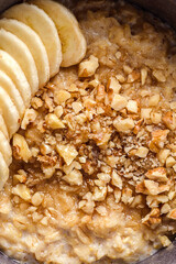 oatmeal porridge with banana, honey and walnuts