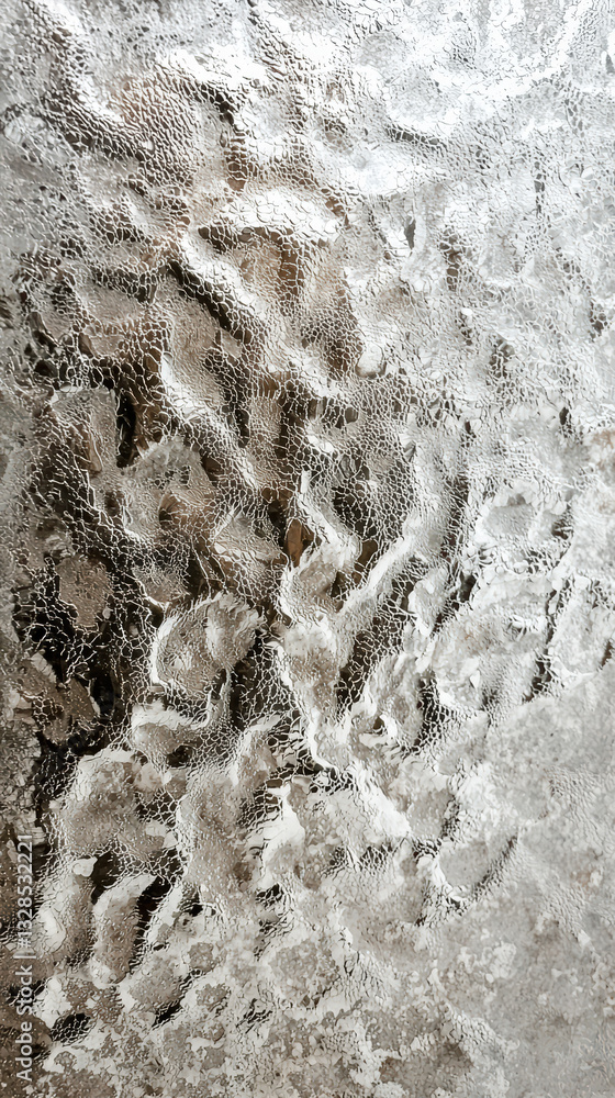 Poster frozen surface: a close-up shot of an icy, textured surface captures the intricate patterns of froze