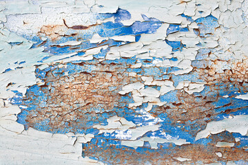 Layers of paint peeling from rusty metal