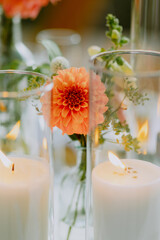 Elegant floral and candle arrangement with warm ambient lighting
