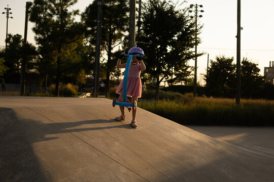 Child Prepares To Ride Down Ramp at Gathering Place Skate Park