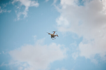 A Drone Hovering in a Blue Sky