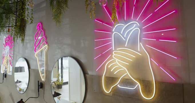 Bright Neon Signs On Wall Of Public Catering Establishment, Closeup View, Interior And Design