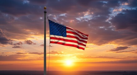 American flag waving in the wind at sunset with a bright sky and clouds