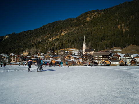 Weissensee, Carinthia, Austria - December 30th 2024 - view of ice skating on the frozen lake