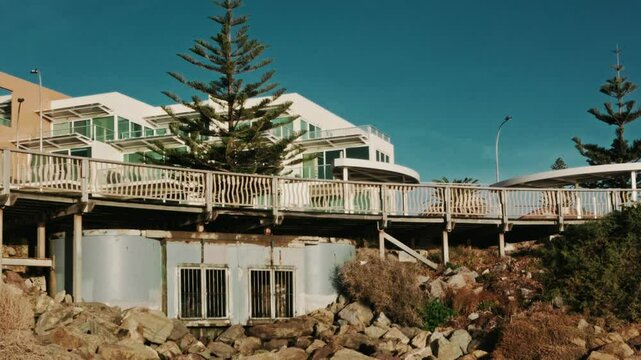 Handheld 4K Coastal White Apartments at Beach Sunset Cinematic (24fps)