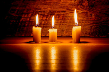 Background with candles light on wood