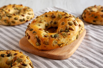 Homemade Healthy Organic Pumpkin Seed Bagels for Breakfast, side view.