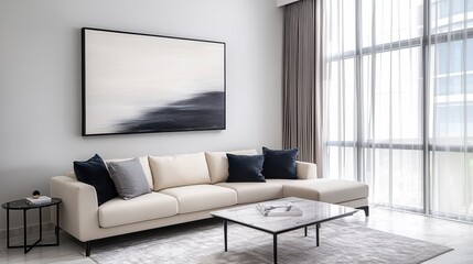 Elegant monochrome living space with cream sofa, marble table, and abstract art piece