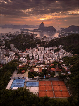 Beautiful aerial view to city buildings and streets with sun rising