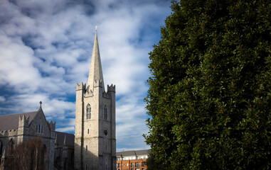 Naklejka premium Dublin, Ireland - March 6th 2025 - Saint Patricks Cathedral and St Patricks Park