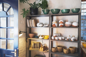 Workshop, small business and ceramics on shelf for pottery, art and manufacturing startup. Clay products, collection and handmade in craft retail, shop and production with creative design in studio