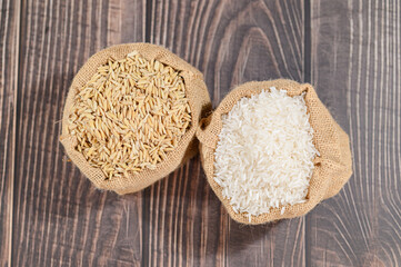 Close-Up of Brown and White Rice in Burlap Sacks on Wooden Surface