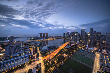 Aerial view of urban skyline and cityscape at sunrise in Marina Bay Singapore.	