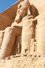 Smaller statues that depict the relatives of the Ramses II at entrance of the Great Temple of Abu...
