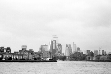 Grainy monochrome cityscape of london showing the city of london skyline