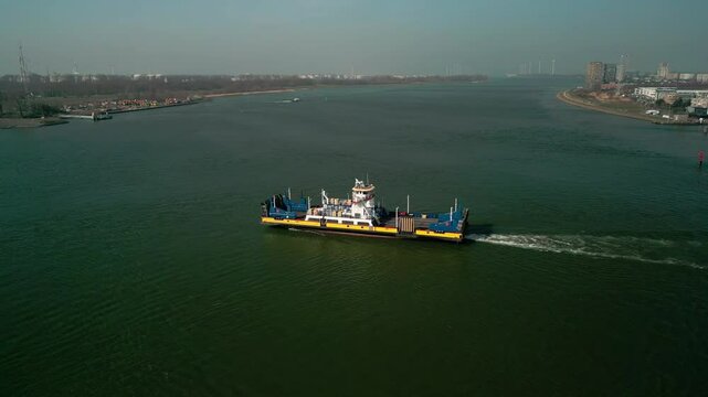 view of a ferry leaving the port in Scheur River heading to Rozenburg on a sunny day in Netherlands