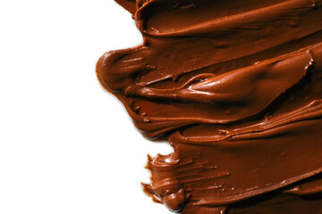 Smooth and glossy chocolate spread smeared on a white surface. The rich brown color and creamy texture highlight the indulgent nature of the sweet dessert ingredient, perfect for baking or spreading