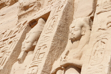 Colossal standing statues of Ramses and Nefertari at entrance of the Temple of Nefertari, Egypt