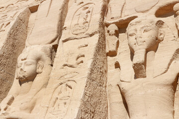Colossal standing statues of Ramses and Nefertari at entrance of the Temple of Nefertari, Egypt