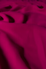 Vibrant Magenta Fabric with Soft Folds – Elegant Abstract Textile Background
