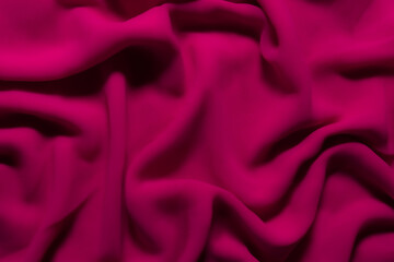 Vibrant Magenta Fabric with Soft Folds – Elegant Abstract Textile Background
