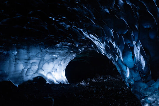 Dark blue and black naturally formed  ice cave with heart shaped bubbles in Vatnajokull Glacier National Park in Iceland