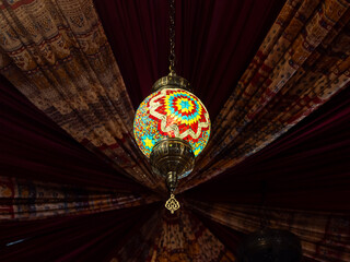 Traditional bright decorative hanging Turkish lamps and colourful lights with vivid colours in the...