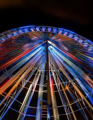Multiple exposure of spinning Ferris wheel at night