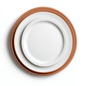 A simple and elegant display of white plates with a terracotta rim, showcasing a minimalist aesthetic.