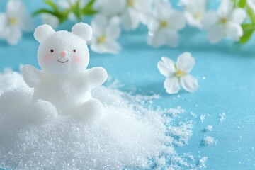Cute Snow Bear Sitting on Pile of Snow with White Flowers