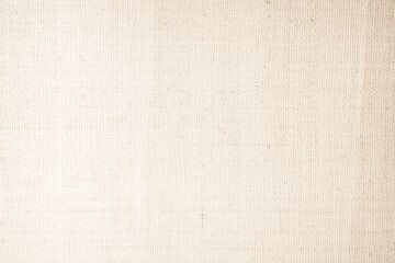 Closeup detail of beige fabric texture background. High resolution photo.
