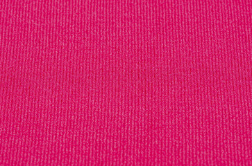 Bright Pink Knitted Fabric Textile Close Up background 