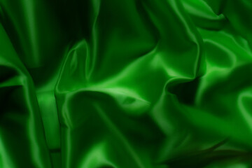 Vibrant green silky fabric with smooth folds and glossy texture. Ideal for luxury fashion, textile design, branding, nature-inspired themes, digital art, and eco-friendly product backgrounds