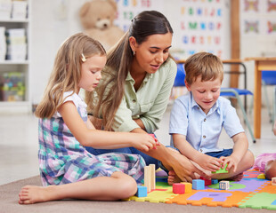 Education, teacher and woman with children, building blocks and construction toys for motor skills...