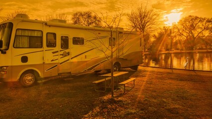 Rv motorhome at campsite at golden hour 