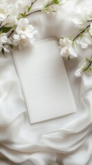 a blank page with fragile pages in wedding background., white fabric and wedding flowers.